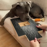 Dog reaching the treat tray on a well-used Barkicure Scratch Pad