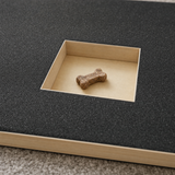 Close-up of the square treat window and sandpaper filing surface